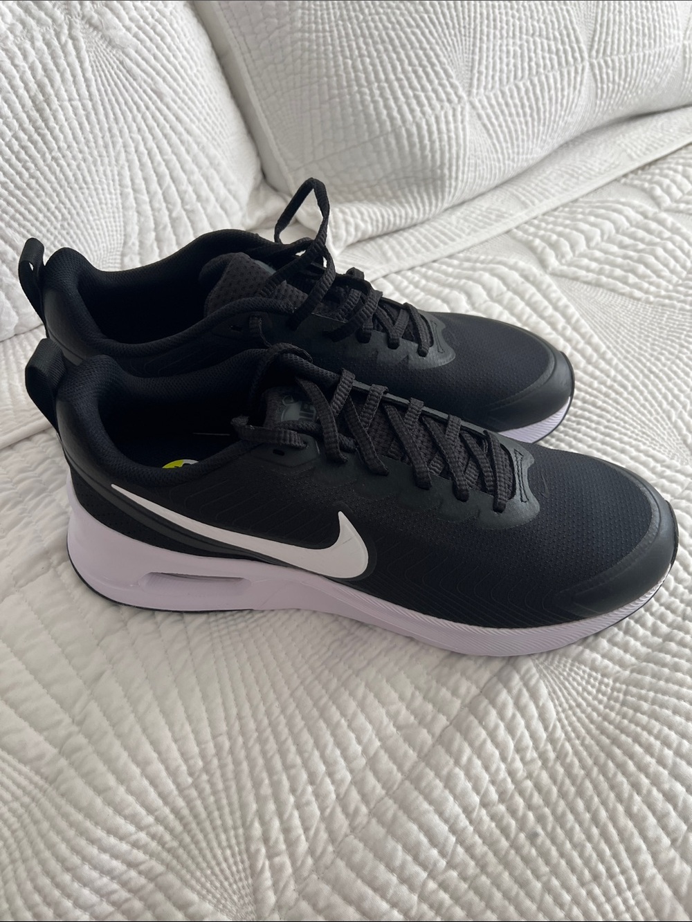 Nike Black Sneakers with White Swoosh and Light Purple Midsole